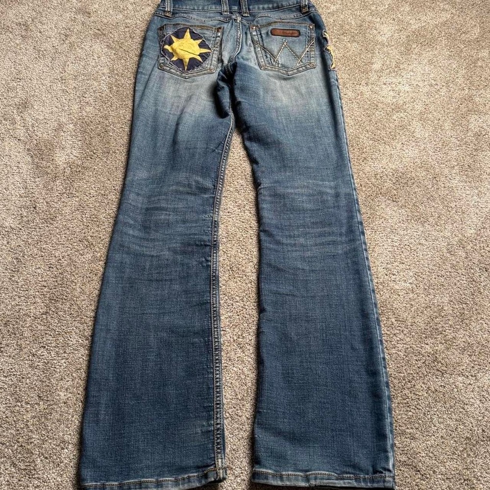 WRANGLER UPCYCLED PATCH LOW RISE BOOTCUT DENIM